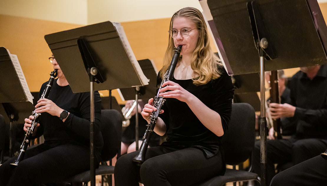Webster University Wind Ensemble A student playing the clarinet during a Webster University Wind Ensemble concert.